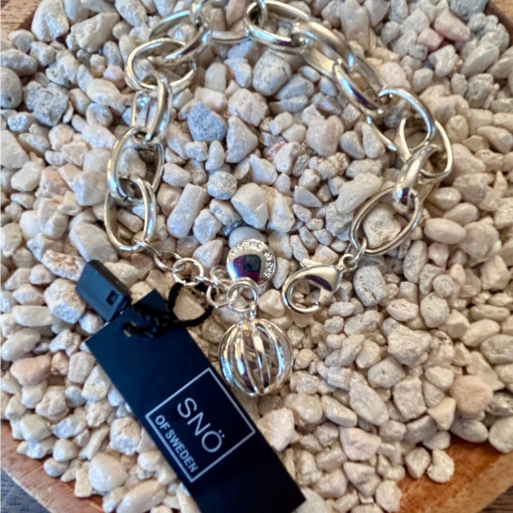 Sterling Silver plated brass Bracelet with globe charm by SNO of Sweden.